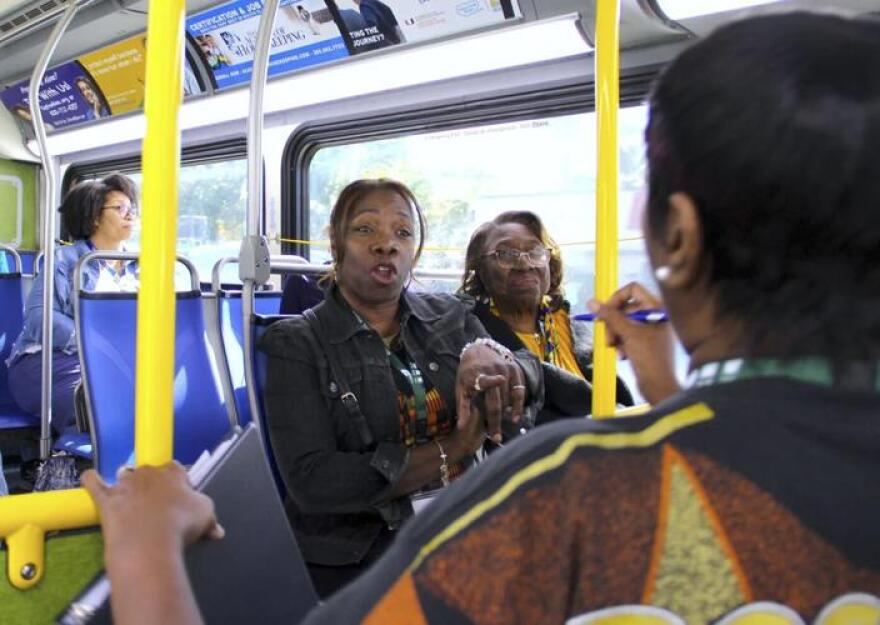 People chat inside a Metrobus