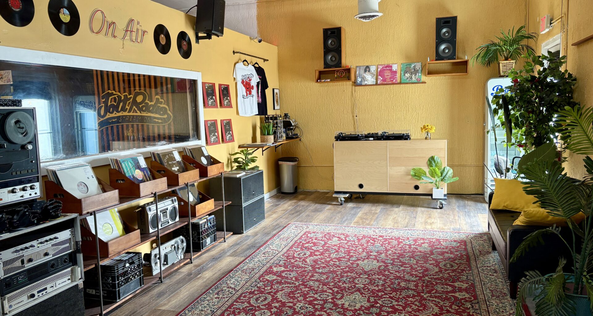 Photo of a space with vinyl records and DJ equipment