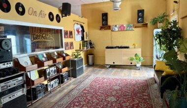 Photo of a space with vinyl records and DJ equipment
