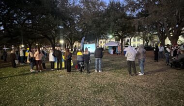 Nearly 100 people gather at Lake Eola Park in downtown Orlando Tuesday to mark the anniversary of the start of the war between Ukraine and Russia. (Spectrum News/Brandon Spencer)