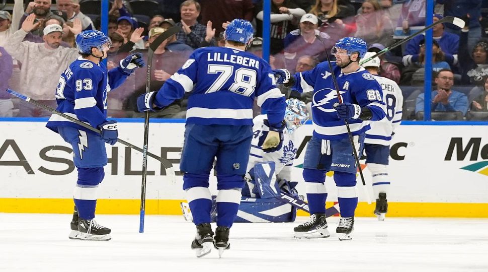 Tampa Bay Lightning right wing Nikita Kucherov (86) celebrates his goal against the Toronto Maple Leafs with center Gage Goncalves (93) and defenseman Emil Lilleberg (78) during the third period of an NHL hockey game Wednesday, Feb. 25, 2026, in Tampa, Fla. (AP Photo/Chris O'Meara)