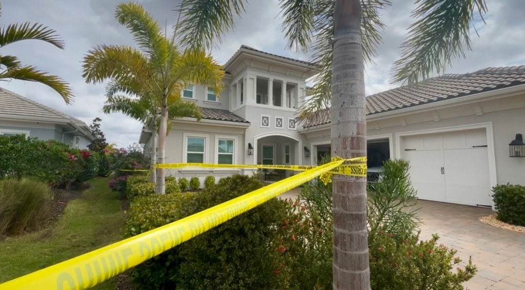 A home is cautioned off with yellow tape. 