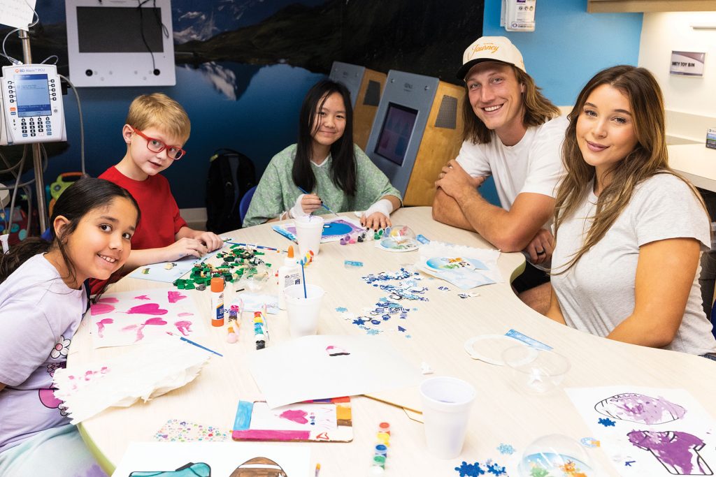 Trevor and Marissa Lawrence spend time crafting with patients at Wolfson Children’s Hospital during a holiday visit on December 3, 2025, sharing creativity, toys and seasonal cheer with children and their families