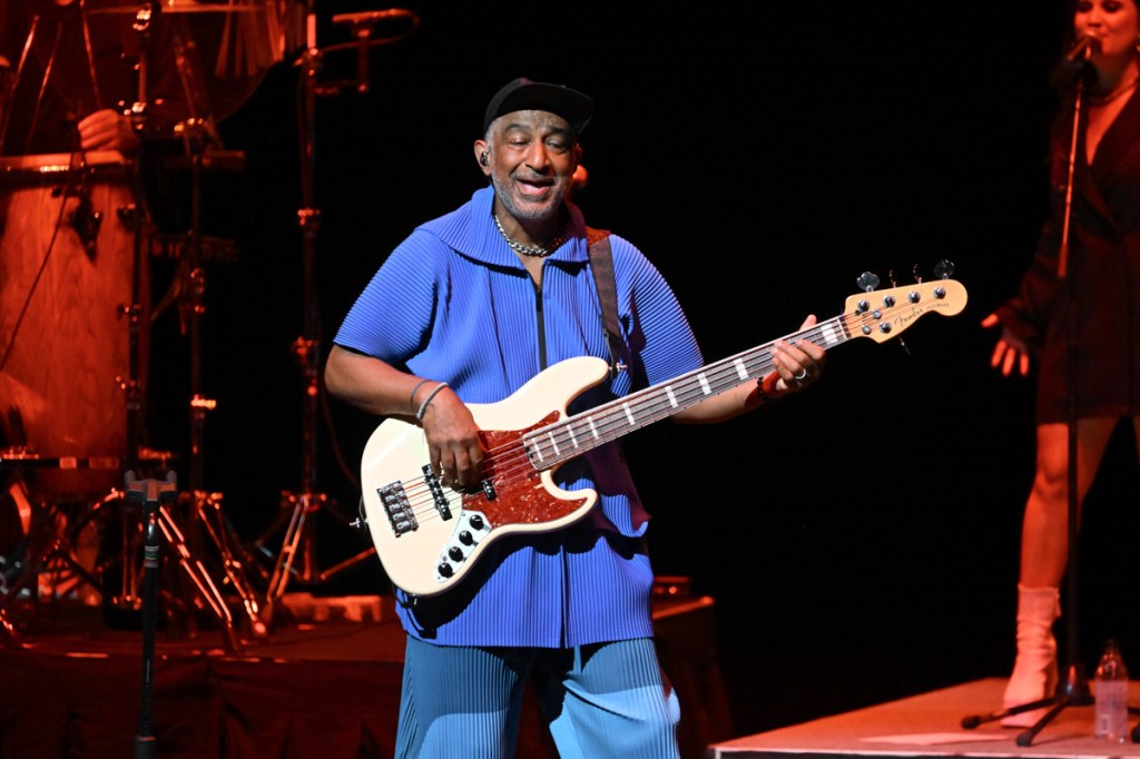 A man playing bass on stage