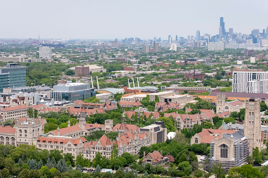 an aerial image of the University of Chicago campus with the city in the background