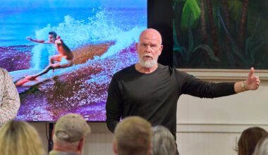 Jacksonville surf legend Terry DeLoach speaks to the audience at the Beaches Museum during the premiere of a film by Mitch Kaufmann.