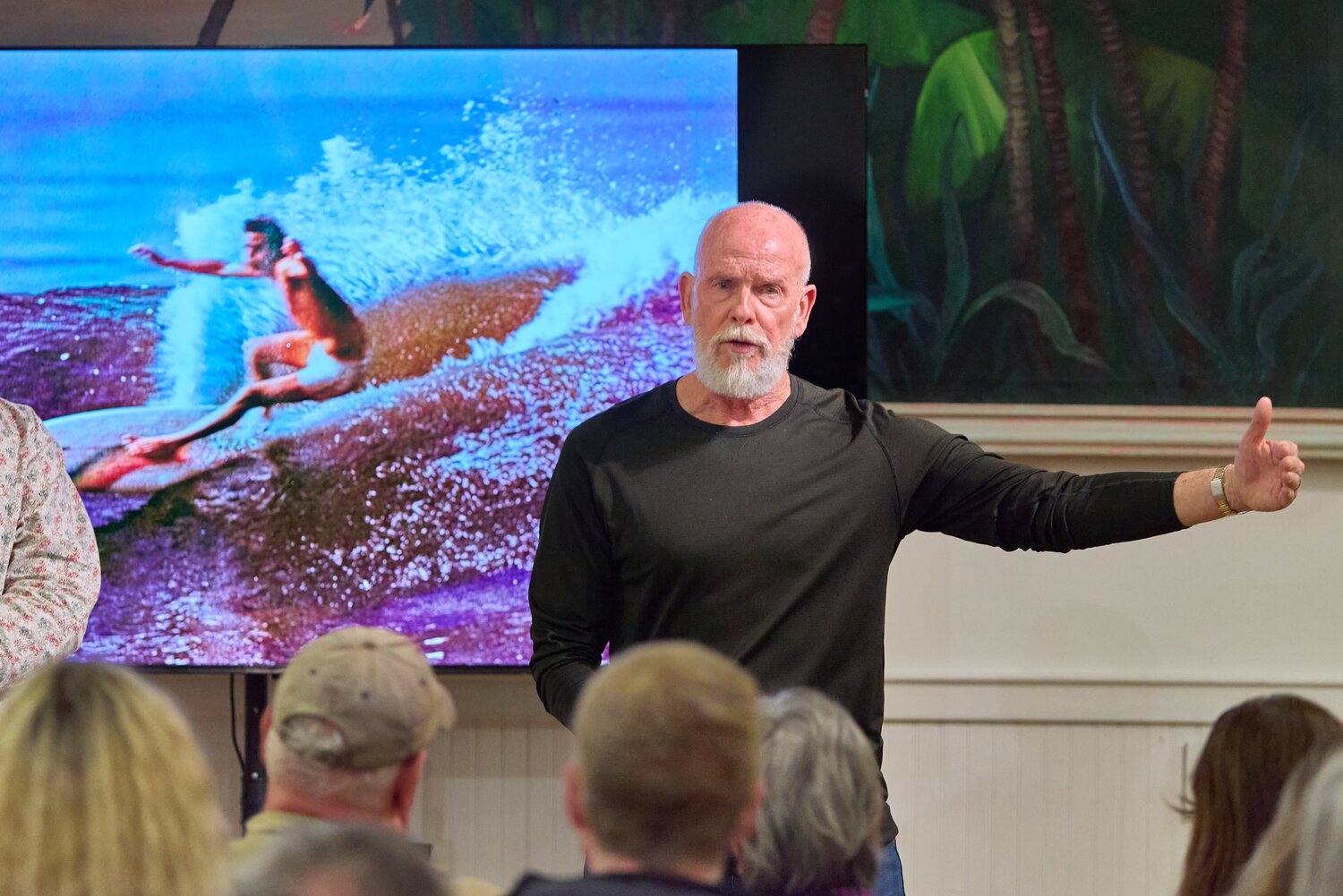 Jacksonville surf legend Terry DeLoach speaks to the audience at the Beaches Museum during the premiere of a film by Mitch Kaufmann.