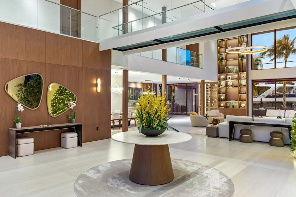 A glass drawbridge is a show-stopping feature near the entry of the home. 