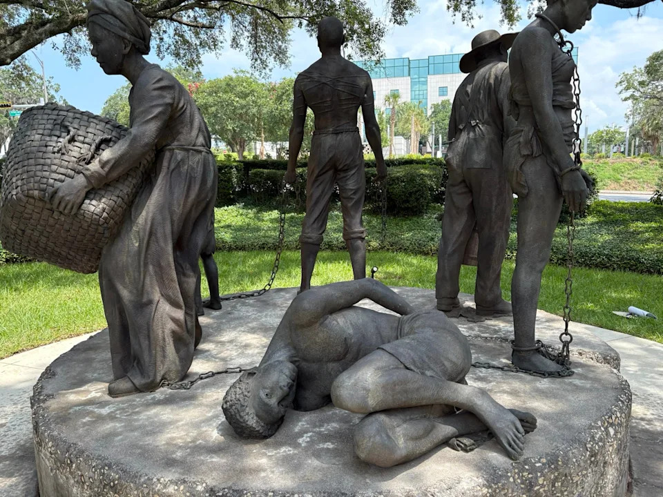In Circle of Chains memorial at the Florida state capitol, one slave breaks the chain that cuffs his wrist but holds on to the one that connects him to the others