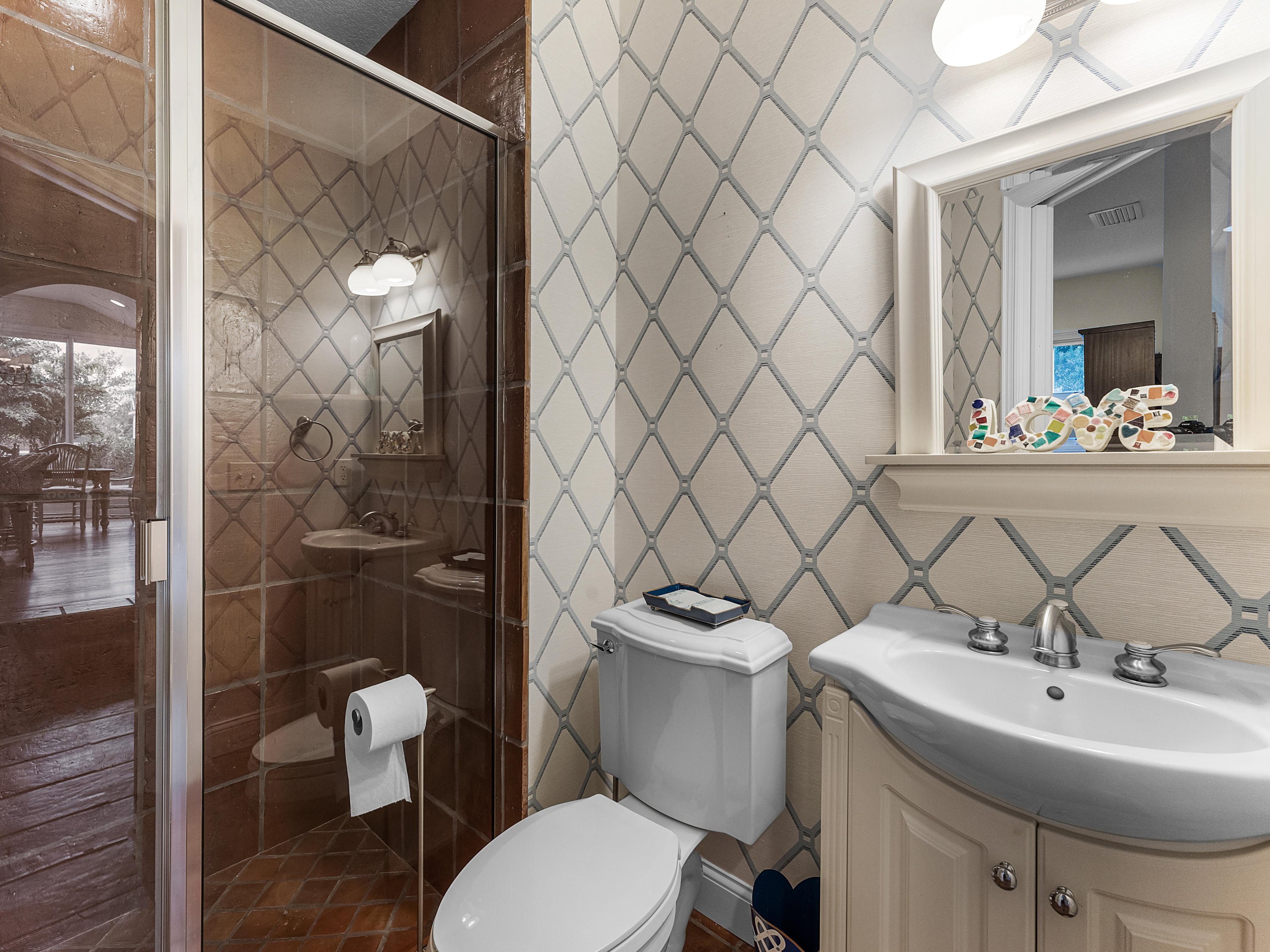 Another bathroom in the home at 1120 Palmer Avenue before...