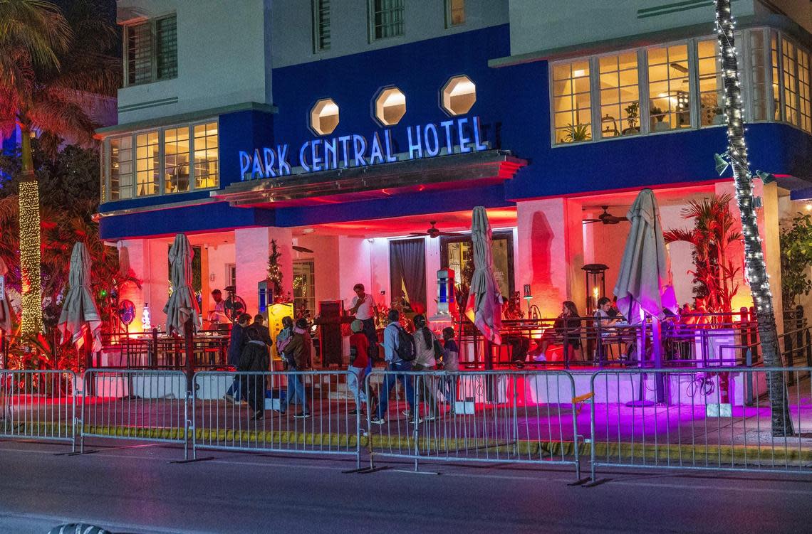 People walk along Ocean Drive during spring break in Miami Beach on March 21, 2025.