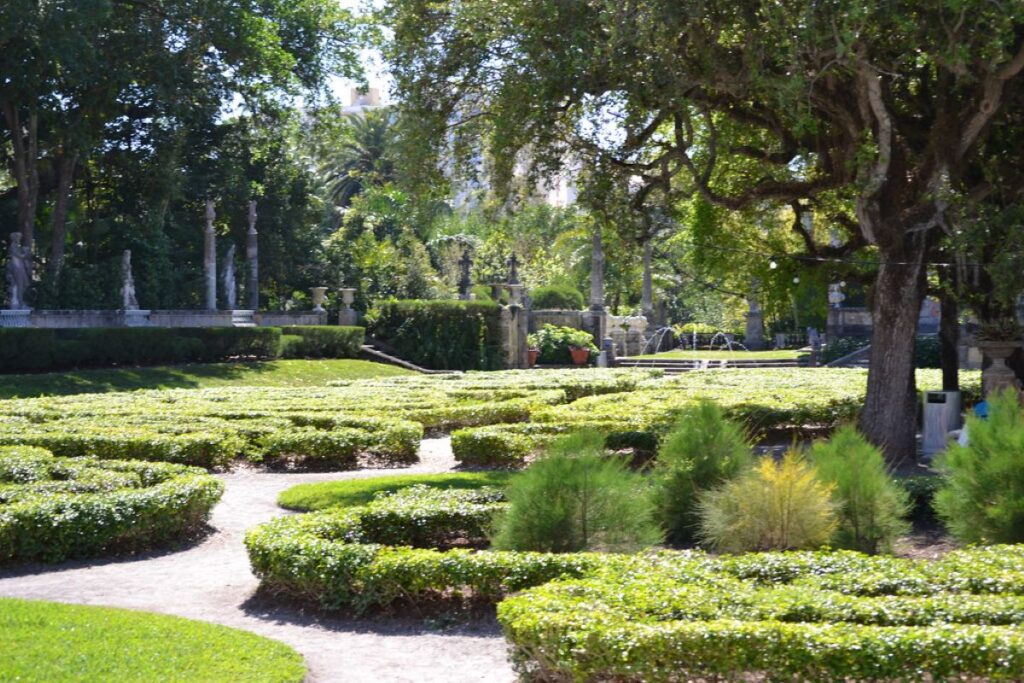 large romantic gardens at back of large palace in Miami