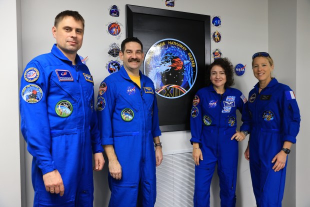From left, Roscosmos cosmonaut Andrey Fedyaev, NASA astronauts Jack Hathaway and Jessica Meir, and ESA (European Space Agency) astronaut Sophie Adenot pose next to their mission insignia inside the Astronaut Crew Quarters in the Neil A. Armstrong Operations and Checkout Building at NASA's Kennedy Space Center in Florida on Monday, Feb. 9, 2026. NASA's SpaceX Crew-12 crew members will launch aboard a SpaceX Dragon spacecraft and Falcon 9 to the International Space Station no earlier than 5:15 a.m. EST on Friday, Feb. 13, from Cape Canaveral Space Force Station's Space Launch Complex 40. (Kim Shiflett/NASA)