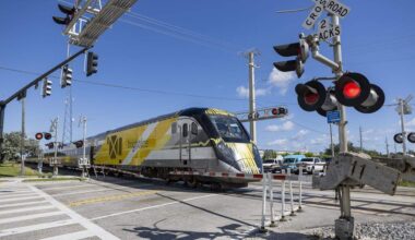 A Brightline train makes its way past the intersection of Northeast 48th Street and North Dixie Highway on Wednesday, Oct. 22, 2025, in Pompano Beach, Fla. Michael Pappis, 40, was riding a scooter when he fatally crashed Thursday, Feb. 19, 2026, with a Brightline train in Pompano Beach.