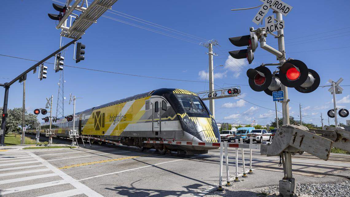 A Brightline train makes its way past the intersection of Northeast 48th Street and North Dixie Highway on Wednesday, Oct. 22, 2025, in Pompano Beach, Fla. Michael Pappis, 40, was riding a scooter when he fatally crashed Thursday, Feb. 19, 2026, with a Brightline train in Pompano Beach.