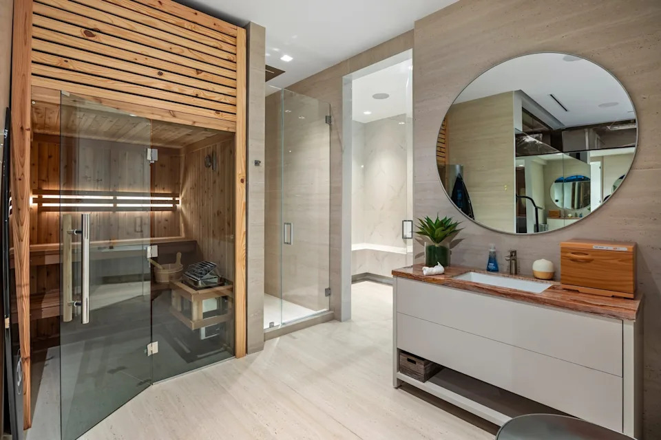 The gym zone of the home includes an indoor sauna and outdoor ice bath.