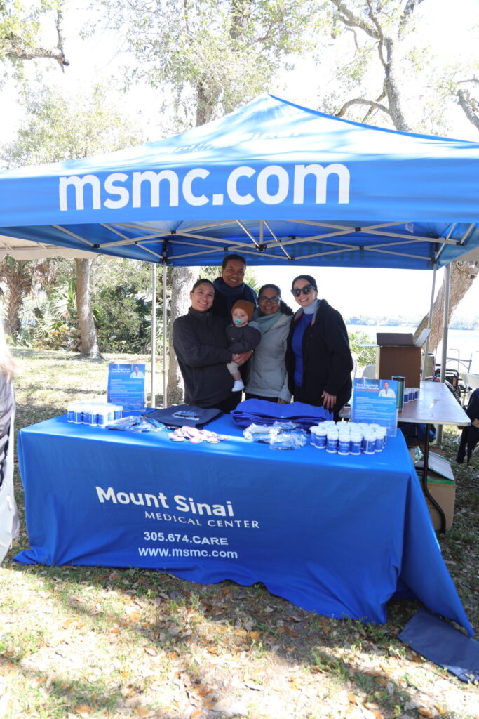 Mount Sinai representatives with logo banner. 