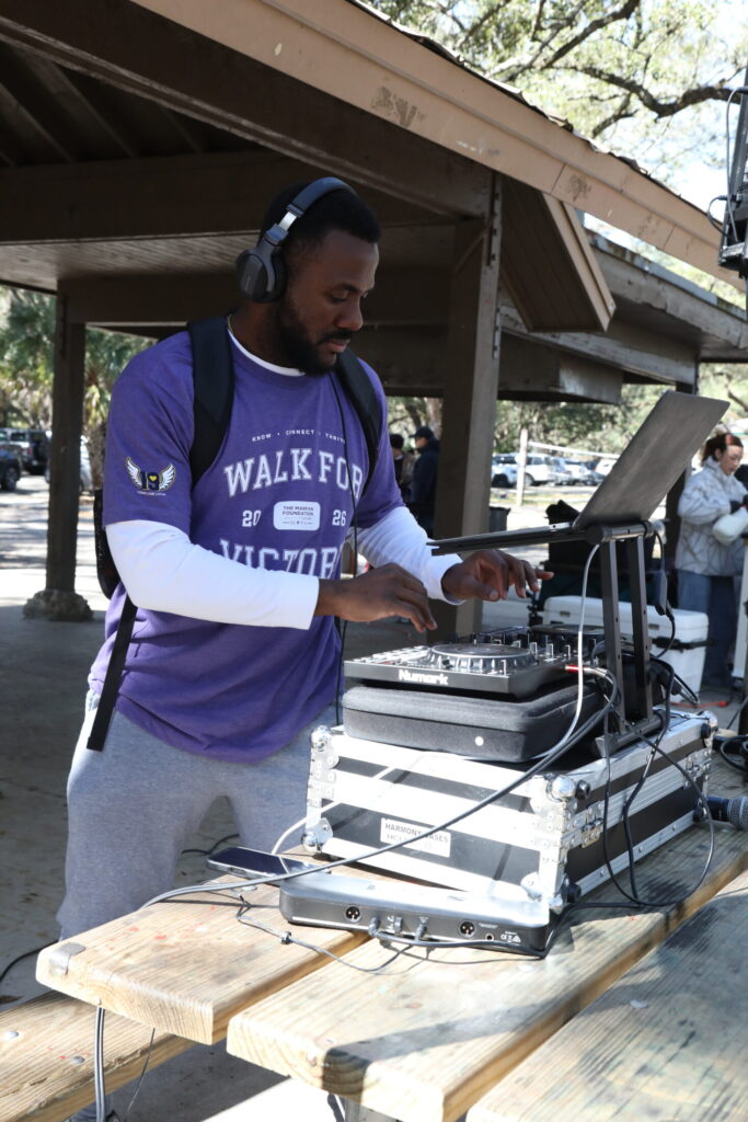 DJ at South Florida Walk for Victory wearing Walk for Victory tee-shirt.