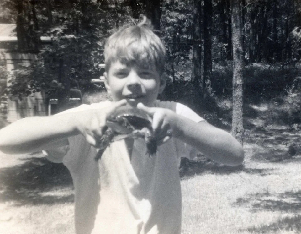 Doug Alderson holding a turtle in Michigan at age 10.