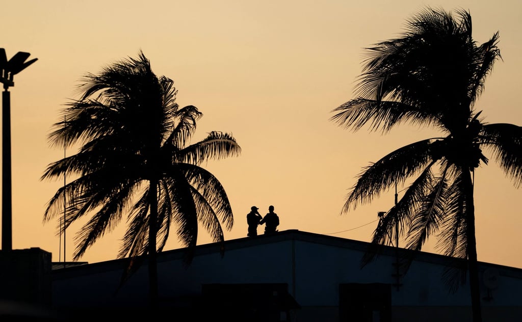 Members of the US Secret Service stand by ahead of President Donald Trump’s arrival at Palm Beach International Airport on February 13. Photo: Getty Images / AFP