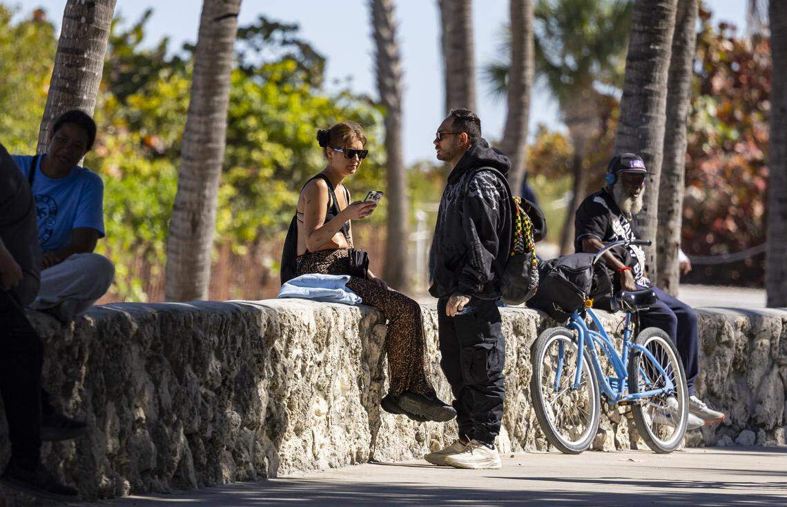 People visit Lummus Park near Ocean Drive on Tuesday, Feb. 24, 2026, in Miami Beach, Florida.