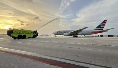 A Miami-Dade Fire Rescue truck gives a traditional water cannon salute to the inaugural Miami-Rome departure of an American Airlines plane.