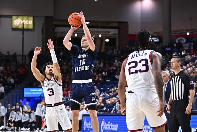 Dec 7, 2025; Spokane, Washington, USA; North Florida Ospreys guard Kent Jackson (10) shoots the ball against Gonzaga Bulldogs guard Braeden Smith (3) in the second half at McCarthey Athletic Center.