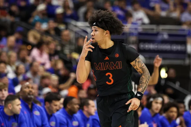 JACKSONVILLE, FLORIDA - NOVEMBER 16: Tre Donaldson #3 of the Miami Hurricanes celebrates after making a three point basket against the Florida Gators during the first half of a game in the Jacksonville Hoops Showdown at VyStar Veterans Memorial Arena on November 16, 2025 in Jacksonville, Florida. (Photo by James Gilbert/Getty Images)