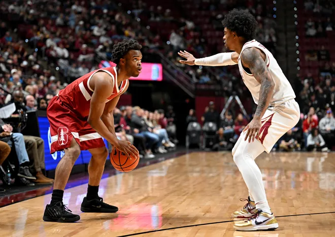 Jan 31, 2026; Tallahassee, Florida, USA; Stanford Cardinal guard Ebuka Okorie (1) looks to the net as Florida State Seminoles guard Martin Somerville (1) defends during the first half at Donald L. Tucker Center. Mandatory Credit: Melina Myers-Imagn Images