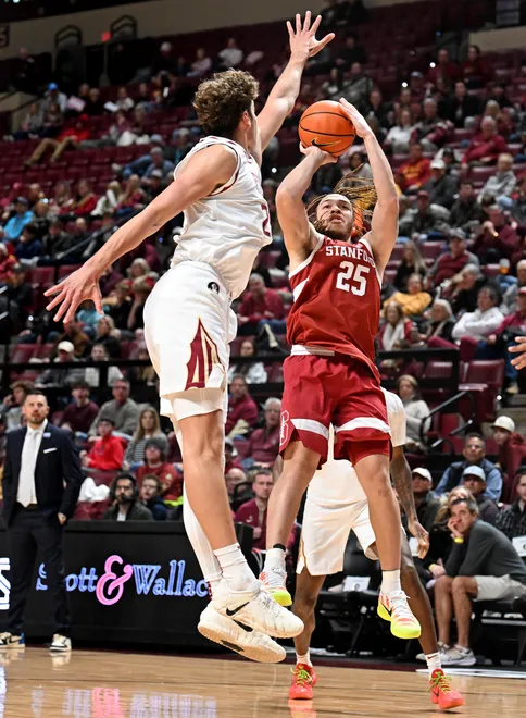 Jan 31, 2026; Tallahassee, Florida, USA; Florida State Seminoles forward Alex Steen (25) attempts to block a shot from Stanford Cardinal guard Jeremy Dent-Smith (25) during the first half at Donald L. Tucker Center. Mandatory Credit: Melina Myers-Imagn Images