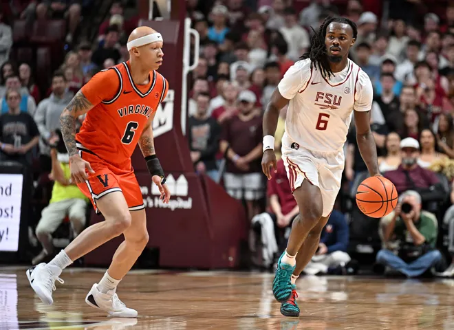 Feb 10, 2026; Tallahassee, Florida, USA; Florida State Seminoles guard Robert McCray (6) drives the ball up the court against Virginia Cavaliers guard Jacari White (6) during the first half at Donald L. Tucker Center. Mandatory Credit: Melina Myers-Imagn Images