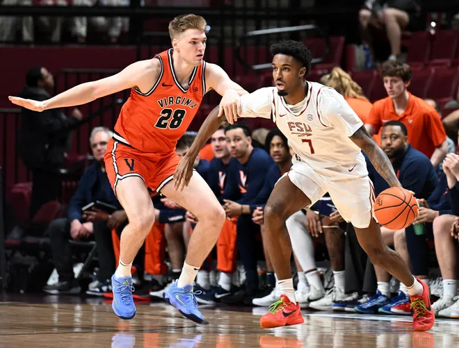 Feb 10, 2026; Tallahassee, Florida, USA; Virginia Cavaliers forward Thijs De Ridder (28) defends Florida State Seminoles forward Chauncey Wiggins (7) during the first half at Donald L. Tucker Center. Mandatory Credit: Melina Myers-Imagn Images