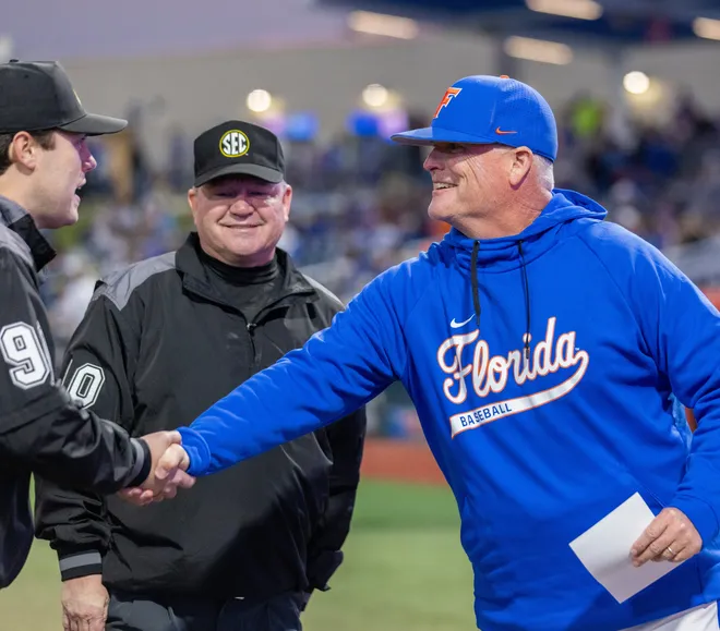 Florida Gators Associate Head Coach Tom Slater shakes hands before the first pitch on Opening Day against UAB, Friday, February 13, 2026, at Condron Family Ballpark in Gainesville, Florida. The Gators lost Game 1 to the Blazers 9-7. [Cyndi Chambers/ Gainesville Sun] 2026