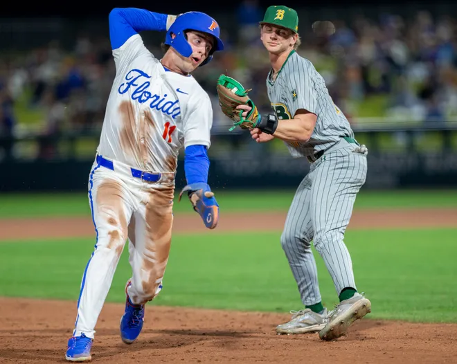 Florida's infielder Brendan Lawson (11) gets tripped up on his way to third against UAB, Friday, February 13, 2026, at Condron Family Ballpark in Gainesville, Florida. The Gators lost Game 1 to the Blazers 9-7. [Cyndi Chambers/ Gainesville Sun] 2026