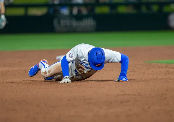 Florida's infielder Brendan Lawson (11) gets tripped up on his way to third against UAB, Friday, February 13, 2026, at Condron Family Ballpark in Gainesville, Florida. The Gators lost Game 1 to the Blazers 9-7. [Cyndi Chambers/ Gainesville Sun] 2026