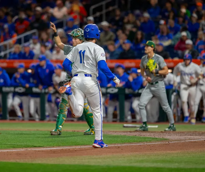 Florida's infielder Brendan Lawson (11) scores a run against UAB, Friday, February 13, 2026, at Condron Family Ballpark in Gainesville, Florida. The Gators lost Game 1 to the Blazers 9-7. [Cyndi Chambers/ Gainesville Sun] 2026