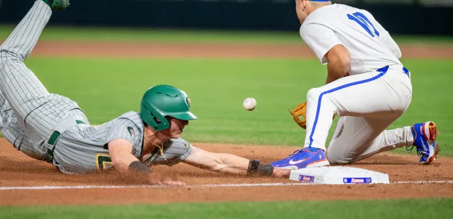 Florida's infielder Ethan Surowiec (10) canÃ•t get the throw in time before UABÃ•s outfielder Landon Beaver (44) tags third, Friday, February 13, 2026, at Condron Family Ballpark in Gainesville, Florida. The Gators lost Game 1 to the Blazers 9-7. [Cyndi Chambers/ Gainesville Sun] 2026