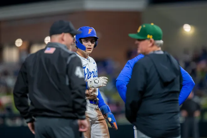 Florida's infielder Brendan Lawson (11) gets tripped up on his way to third against UAB, Friday, February 13, 2026, at Condron Family Ballpark in Gainesville, Florida. The Gators lost Game 1 to the Blazers 9-7. [Cyndi Chambers/ Gainesville Sun] 2026