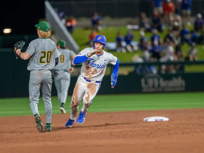 Florida's infielder Brendan Lawson (11) gets tripped up on his way to third against UAB, Friday, February 13, 2026, at Condron Family Ballpark in Gainesville, Florida. The Gators lost Game 1 to the Blazers 9-7. [Cyndi Chambers/ Gainesville Sun] 2026
