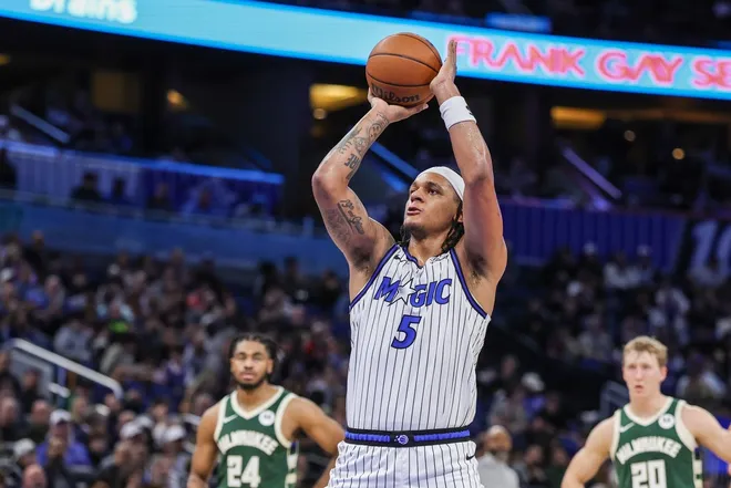 Feb 11, 2026; Orlando, Florida, USA; Orlando Magic forward Paolo Banchero (5) shoots a free throw after a technical foul during the second half against the Milwaukee Bucks at Kia Center.