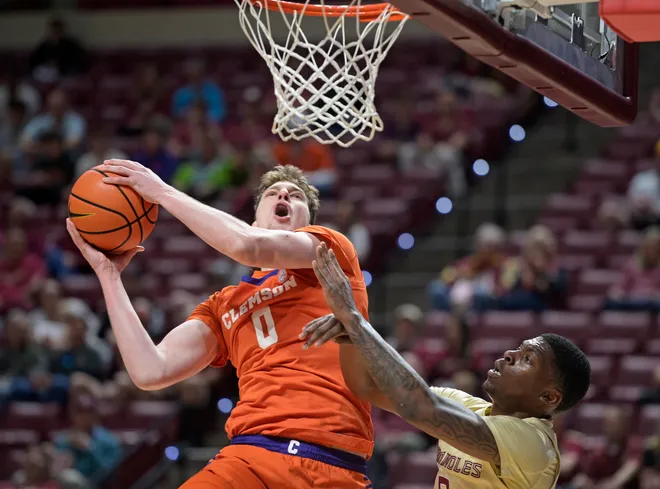 Feb 15, 2025; Tallahassee, Florida, USA; Clemson Tigers center Vicktor Lakhin (0) shoots the ball past Florida State Seminoles guard Chandler Jackson (0) during the first half at Donald L. Tucker Center. Mandatory Credit: Melina Myers-Imagn Images