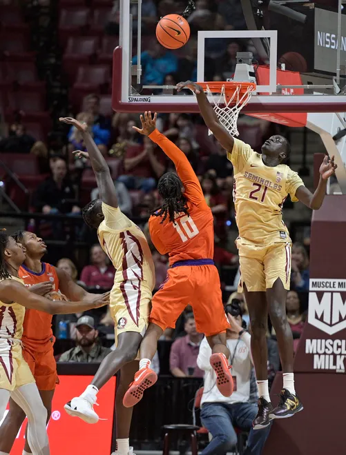 Feb 15, 2025; Tallahassee, Florida, USA; Clemson Tigers guard Del Jones (10) has a shot blocked by Florida State Seminoles forward Alier Maluk (21) during the first half at Donald L. Tucker Center. Mandatory Credit: Melina Myers-Imagn Images