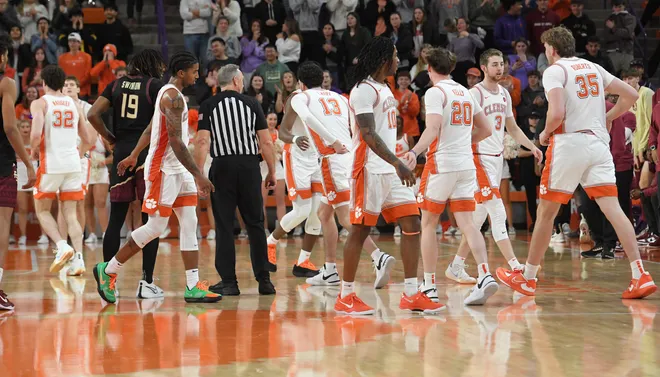Jan 11, 2025; Clemson, South Carolina, USA; Clemson Tigers bench players get in a game during the last minute against the Florida State Seminoles during the second half at Littlejohn Coliseum. Mandatory Credit: Ken Ruinard/USA TODAY Network via Imagn Images