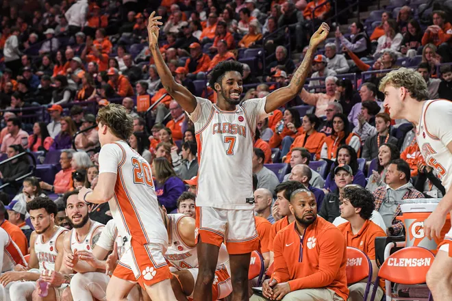 Jan 11, 2025; Clemson, South Carolina, USA; Clemson Tigers forward Chauncey Wiggins (7) cheers as bench players get in a game during the last minute against the Florida State Seminoles during the second half at Littlejohn Coliseum. Mandatory Credit: Ken Ruinard/USA TODAY Network via Imagn Images