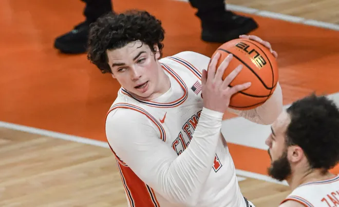 Jan 11, 2025; Clemson, South Carolina, USA; Clemson Tigers forward Ian Schieffelin (4) rebounds against the Florida State Seminoles during the first half at Littlejohn Coliseum. Mandatory Credit: Ken Ruinard/USA TODAY Network via Imagn Images