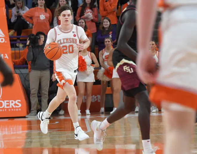 Jan 11, 2025; Clemson, South Carolina, USA; Clemson Tigers guard Matt Kelly (20) dribbles the ball against the Florida State Seminoles during the second half at Littlejohn Coliseum. Mandatory Credit: Ken Ruinard/USA TODAY Network via Imagn Images