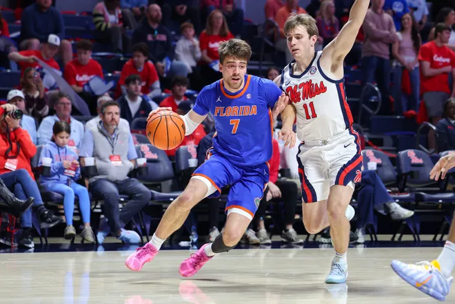 OXFORD, MISSISSIPPI - FEBRUARY 21: Urban Klavzar #7 of the Florida Gators drives against Travis Perry #11 of the Ole Miss Rebels during the first half at The Pavilion at Ole Miss on February 21, 2026 in Oxford, Mississippi. (Photo by Wes Hale/Getty Images)