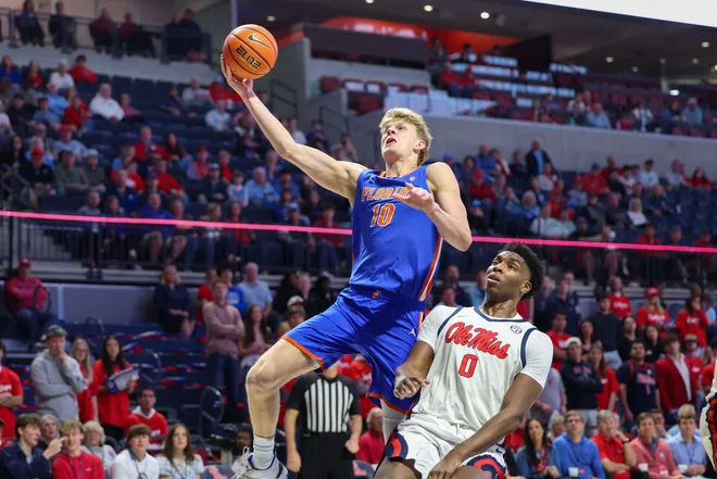 OXFORD, MISSISSIPPI - FEBRUARY 21: Thomas Haugh #10 of the Florida Gators shoots the ball against Malik Dia #0 of the Ole Miss Rebels during the first half at The Pavilion at Ole Miss on February 21, 2026 in Oxford, Mississippi. (Photo by Wes Hale/Getty Images)