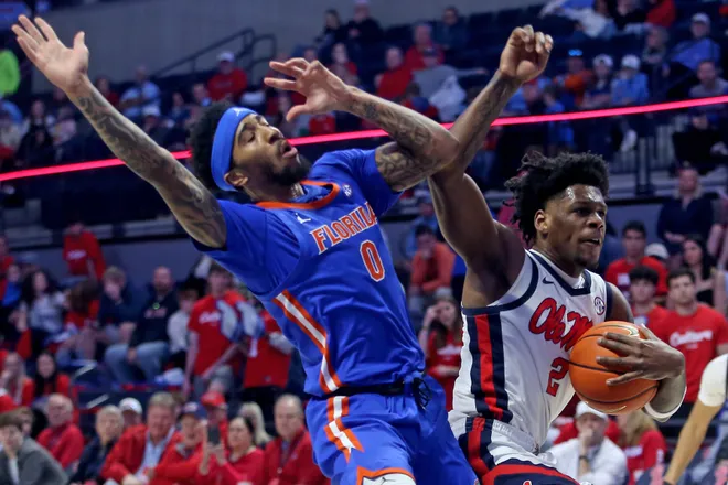 Feb 21, 2026; Oxford, Mississippi, USA; Mississippi Rebels guard AJ Storr (2) drives to the basket as Florida Gators guard Boogie Fland (0) defends during the first half at The Sandy and John Black Pavilion at Ole Miss. Mandatory Credit: Petre Thomas-Imagn Images