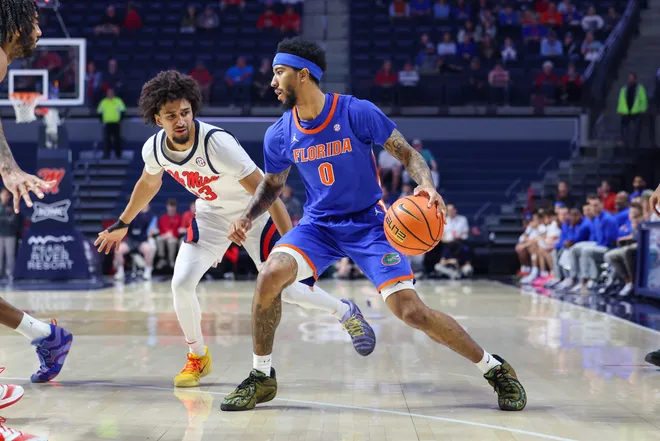 OXFORD, MISSISSIPPI - FEBRUARY 21: Boogie Fland #0 of the Florida Gators handles the ball against Patton Pinkins #23 of the Ole Miss Rebels during the first half at The Pavilion at Ole Miss on February 21, 2026 in Oxford, Mississippi. (Photo by Wes Hale/Getty Images)